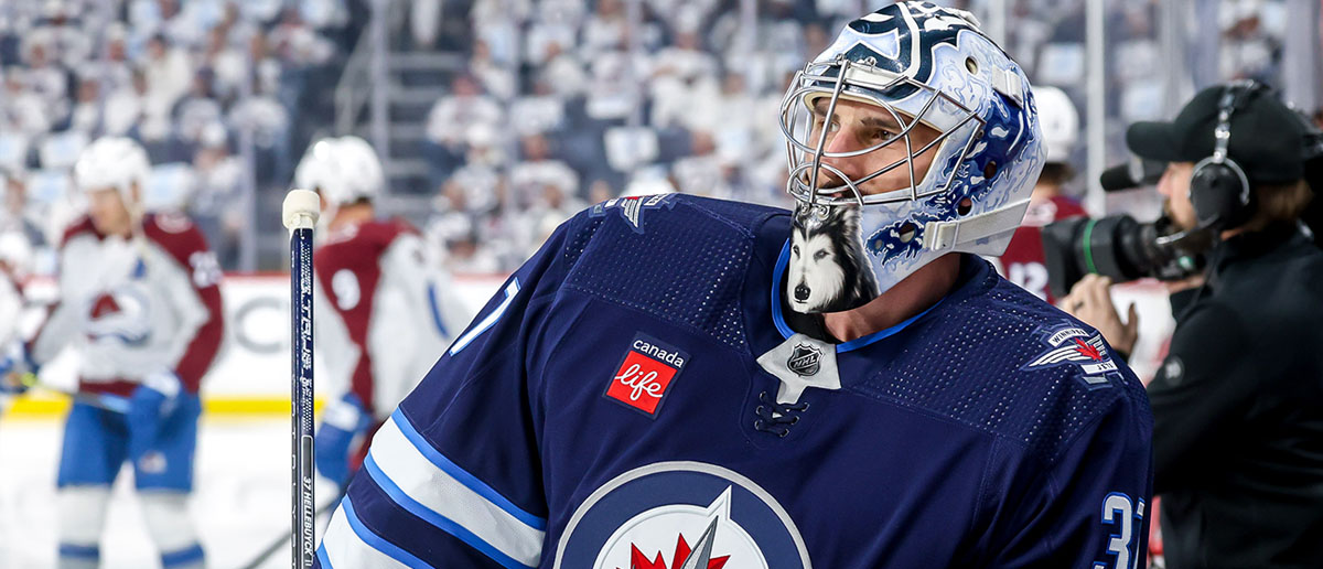 Goaltender Connor Hellebuyck #37 of the Winnipeg Jets looks on during the pre-game warm up prior to NHL action against the Colorado Avalanche in Game Two of the First Round of the 2024 Stanley Cup Playoffs at the Canada Life Centre on April 23, 2024 in Winnipeg