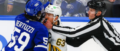 Boston Bruins left wing Brad Marchand and Toronto Maple Leafs left wing Tyler Bertuzzi going at each other as linesman Ryan Daisy breaks them apart in the second period. (Leafs Predictons)