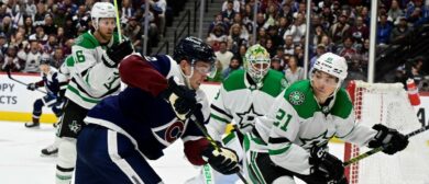 Colorado Avalanche left wing Artturi Lehkonen (62) and Dallas Stars left wing Jason Robertson (21) battle in front of Dallas Stars goaltender Jake Oettinger (29) during the first period at Ball Arena in Denver, Colorado on Sunday, April 07, 2024