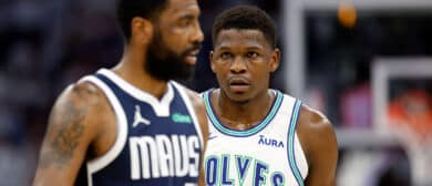 Anthony Edwards #5 of the Minnesota Timberwolves looks at Kyrie Irving #11 of the Dallas Mavericks during the first quarter in Game One of the Western Conference Finals at Target Center on May 22, 2024 in Minneapolis, Minnesota.
