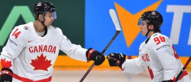Canada's forward #98 Connor Bedard celebrates with his team-mate Canada's forward #14 Dylan Guenther after he scored during the IIHF Ice Hockey Men's World Championships match between Canada and Denmark in Prague, Czech Republic on May 12, 2024.