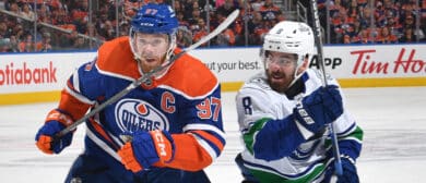 Connor McDavid #97 of the Edmonton Oilers skates against Conor Garland #8 of the Vancouver Canucks in Game Six of the Second Round of the 2024 Stanley Cup Playoffs at Rogers Place on May 18, 2024, in Edmonton, Alberta, Canada.