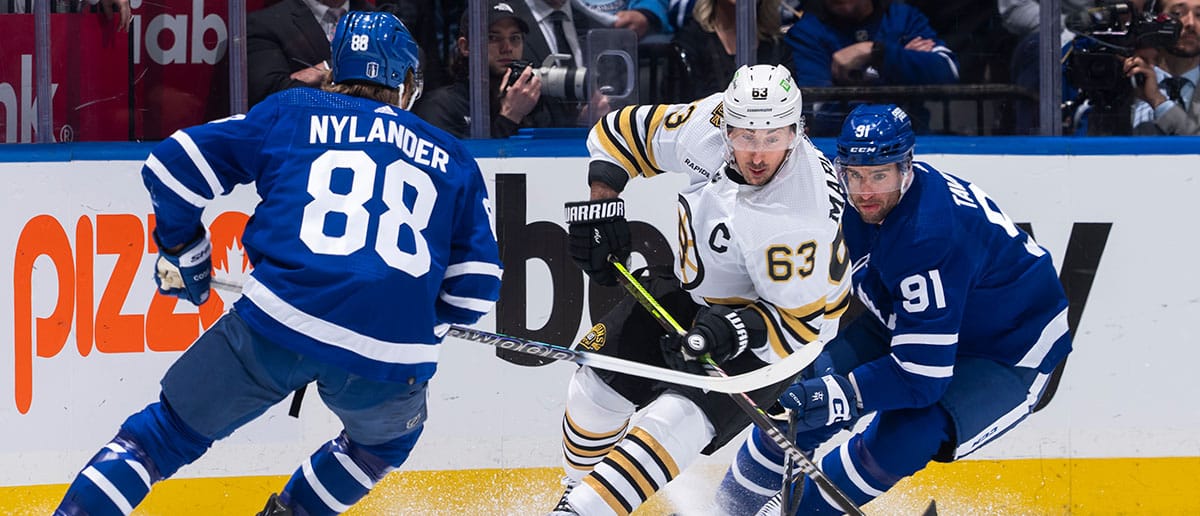 Brad Marchand #63 of the Boston Bruins skates against William Nylander #88 and John Tavares #91 of the Toronto Maple Leafs during the first period in Game Four of the First Round of the 2024 Stanley Cup Playoffs at Scotiabank Arena on April 27, 2024 in Toronto, Ontario, Canada. (Leafs predictions)