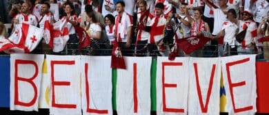 Georgia's supporters wave ahead of the UEFA Euro 2024 Group F football match between Georgia and the Czech Republic at the Volksparkstadion in Hamburg on June 22, 2024
