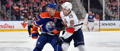Connor McDavid #97 of the Edmonton Oilers battles for position against Matthew Tkachuk #19 of the Florida Panthers during the game on November 28, 2022 at Rogers Place in Edmonton, Alberta, Canada.