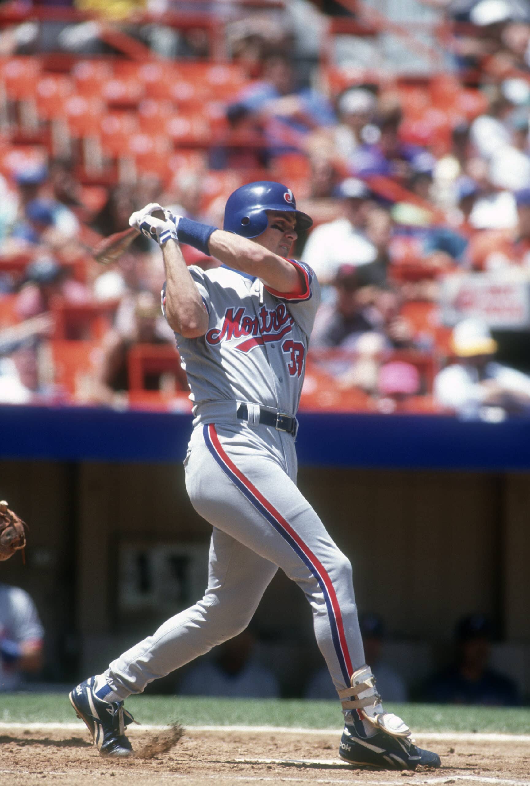 NEW YORK - CIRCA 1993: Larry Walker #33 of the Montreal Expos swings and watches the flight of his ball against the New York Mets during an Major League Baseball game circa 1993 at Shea Stadium in the Queens borough of New York City. Walker played for the Expos from 1989-94. (Photo by Focus on Sport/Getty Images)