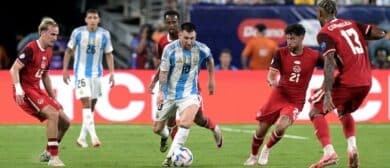 Argentina's forward #10 Lionel Messi fights for the ball with Canada's midfielder #23 Liam Millar, Canada's midfielder #20 Ali Ahmed, Canada's defender #13 Derek Cornelius and Canada's midfielder #21 Jonathan Osorio during the Conmebol 2024 Copa America tournament semi-final football match between Argentina and Canada at MetLife Stadium, in East Rutherford, New Jersey on July 9, 2024.