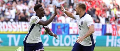 Bukayo Saka of England celebrates scoring his team's first goal with teammate Luke Shaw during the UEFA EURO 2024 quarter-final match between England and Switzerland at Düsseldorf Arena on July 06, 2024 in Dusseldorf, Germany.