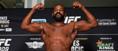 Jon Jones poses on the scale during the UFC 309 official weigh-in at the New York Hilton Midtown on November 15, 2024 in New York City.