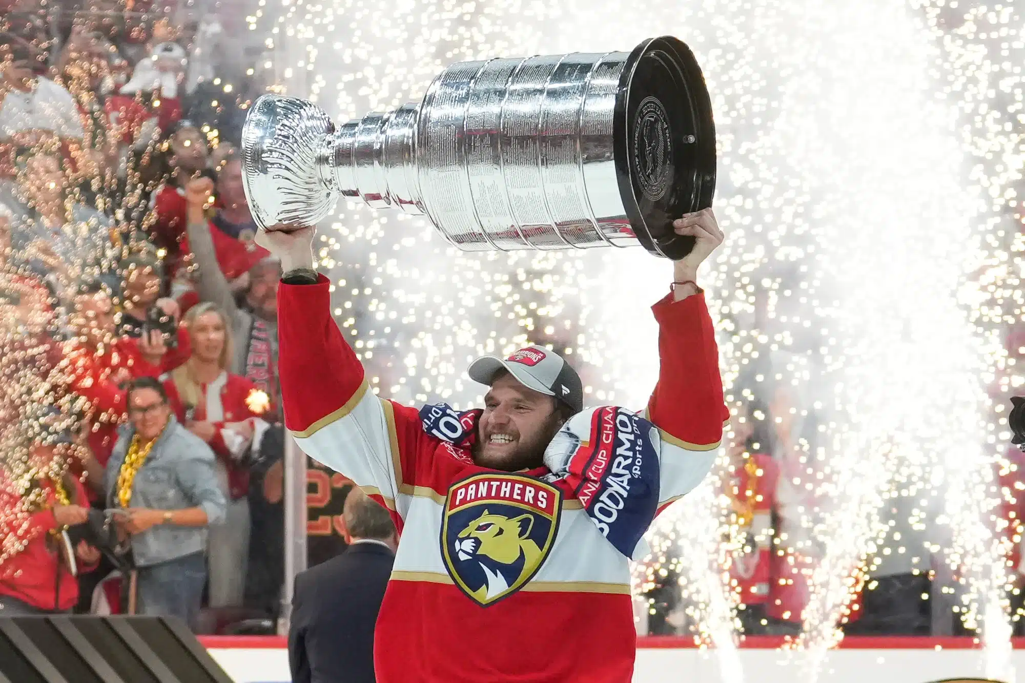 Alexander Barkov, captain of the Florida Panthers, lifts the Stanley Cup after beating the Edmonton Oilers in 7 games in the 2024 Stanley Cup final.