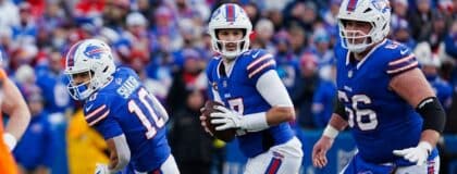uffalo Bills quarterback Josh Allen (17) runs parallel looking for an open play during the second half of the Buffalo Bills wild card game against the Denver Broncos at Highmark Stadium in Orchard Park on Jan. 12, 2025.