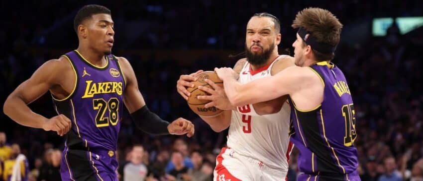 Houston Rockets forward Dillon Brooks (9) is fouled by Los Angeles Lakers guard Austin Reaves (15) during the fourth quarter at Crypto.com Arena.