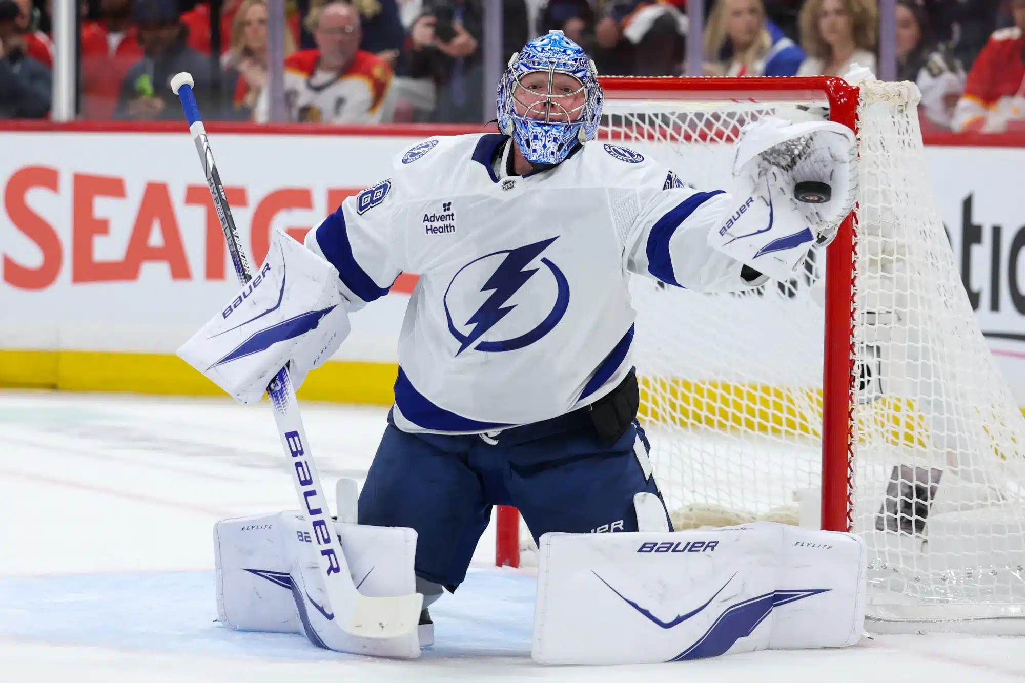 Apr 26, 2025; Sunrise, Florida, USA; Tampa Bay Lightning goaltender Andrei Vasilevskiy (88) makes a save against the Florida Panthers in the first period during game three of the first round of the 2025 Stanley Cup Playoffs at Amerant Bank Arena.