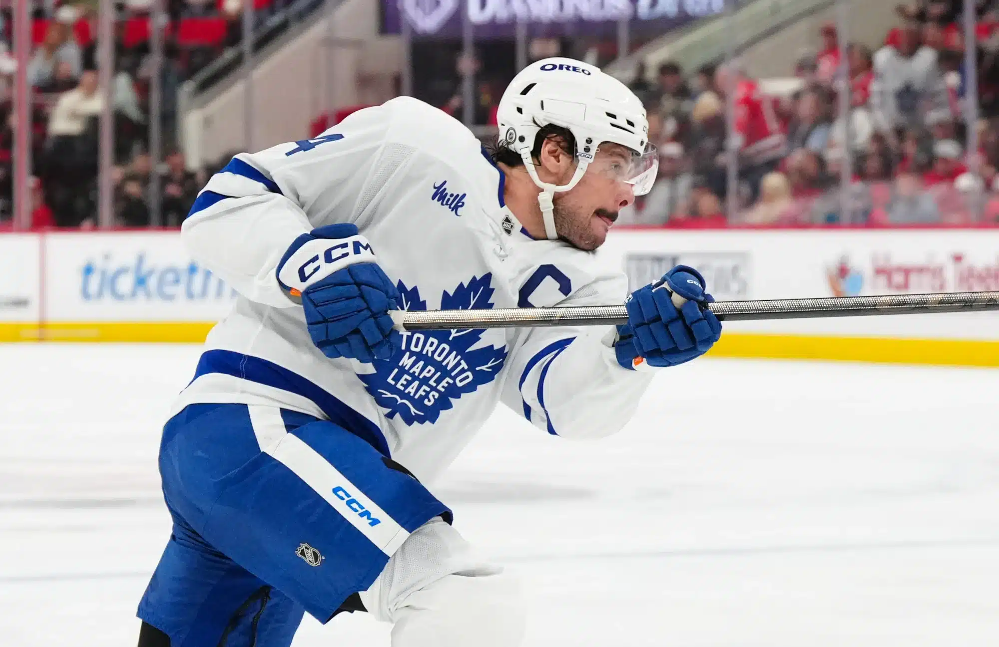 Apr 13, 2025; Raleigh, North Carolina, USA; Toronto Maple Leafs center Auston Matthews (34) takes a shot against the Carolina Hurricanes during the second period at Lenovo Center.