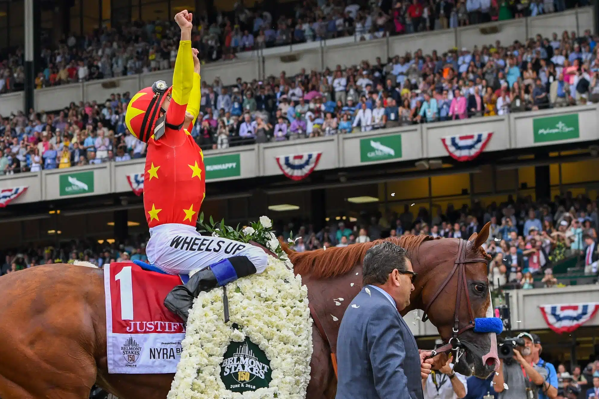 June 9, 2018; Elmont, NY, USA; Mike Smith aboard Justify (1) celebrates the winning of the 150th running of the Belmont Stakes and the Triple Crown at Belmont Park.