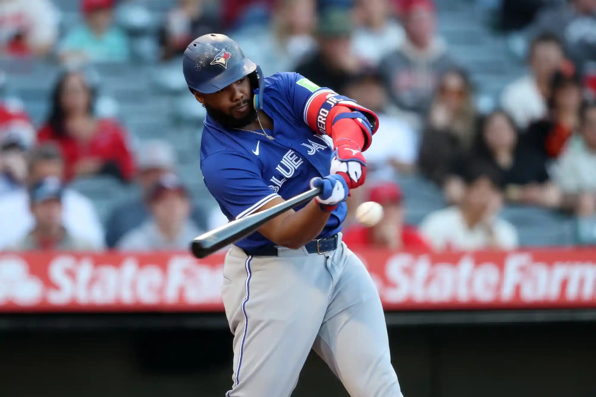 May 7, 2025; Anaheim, California, USA; Toronto Blue Jays first baseman Vladimir Guerrero Jr. (27) hits a single during the first inning against the Los Angeles Angels at Angel Stadium.