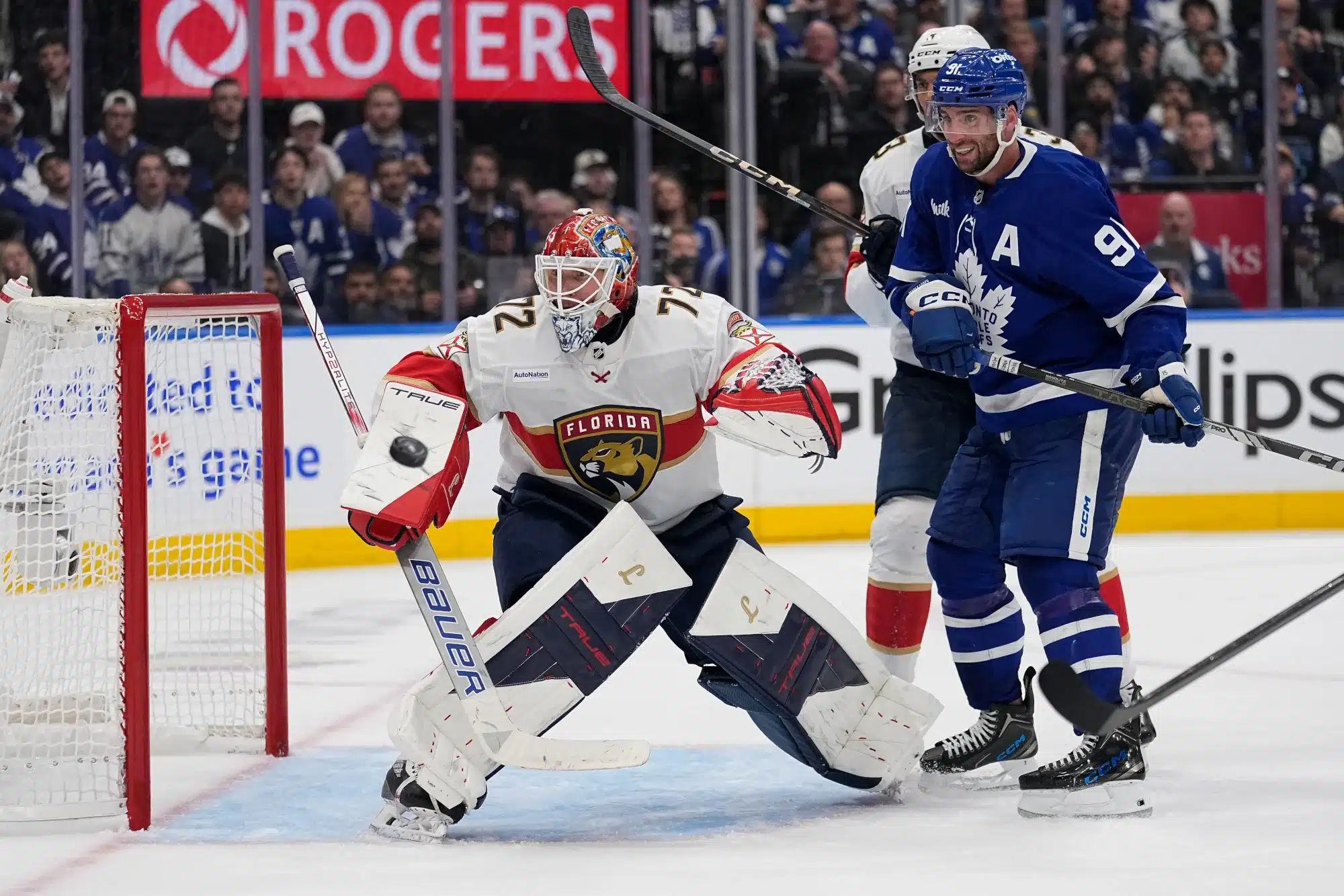 May 5, 2025; Toronto, Ontario, CAN; Florida Panthers goaltender Sergei Bobrovsky (72) and Toronto Maple Leafs forward John Tavares (91) watch a shot go wide of the net during the third period of the second round of the 2025 Stanley Cup Playoffs at Scotiabank Arena.