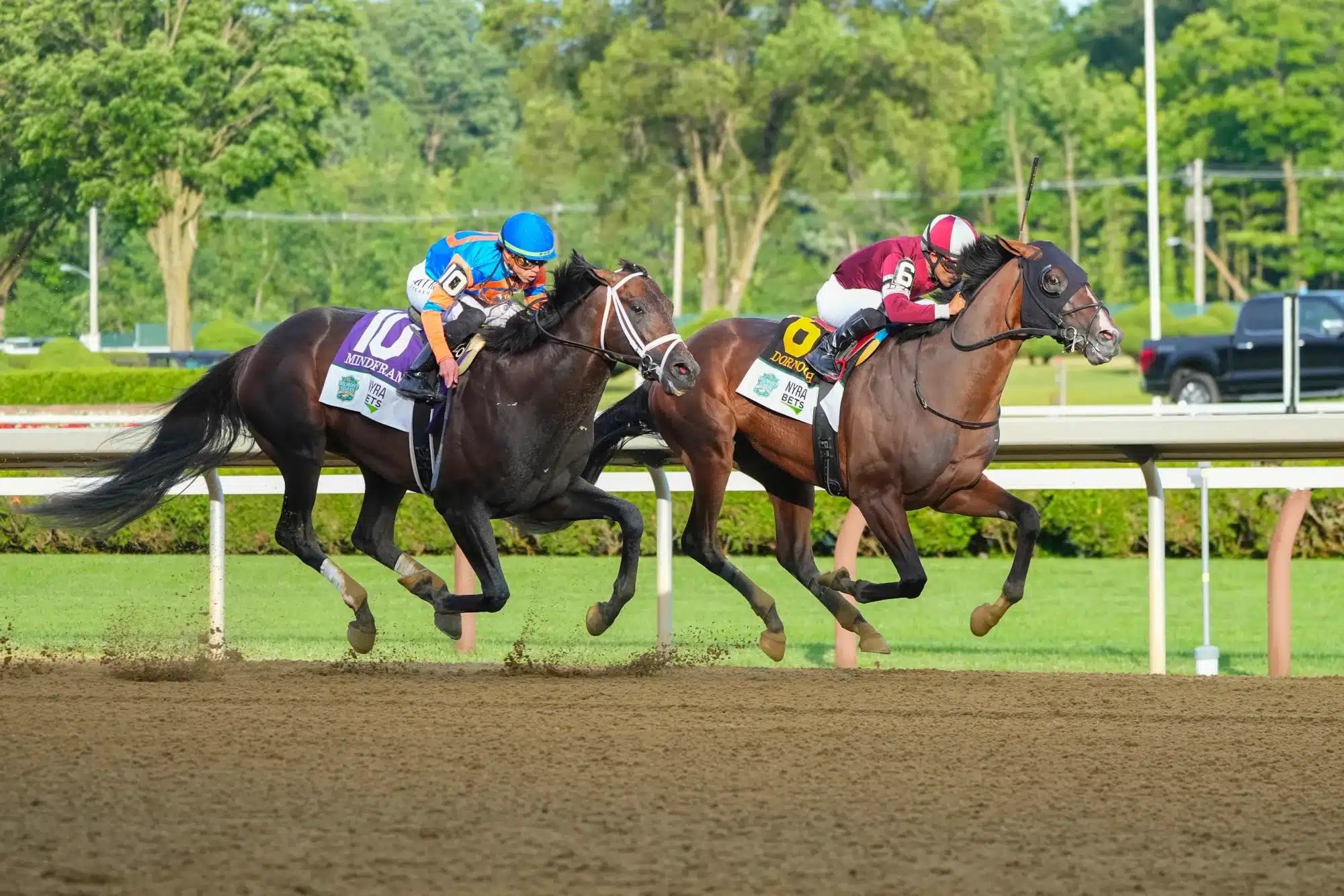 Jun 8, 2024; Saratoga Springs, NY, USA; Dornoch with Luis Saez up (6) in the lead down the final front stretch followed by Mindframe with Irad Ortiz Jr. up (10) during the Belmont Stake at Saratoga Race Course.