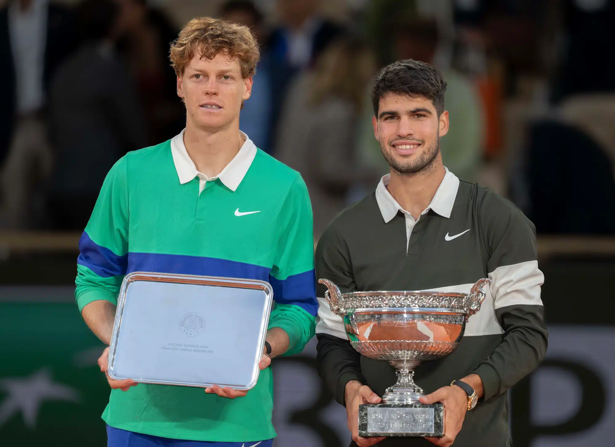 Jun 8, 2025; Paris, FR; Jannik Sinner of Italy and Carlos Alcaraz of Spain pose together at the trophy presentation after the men’s singles final on day 15 at Roland Garros Stadium.