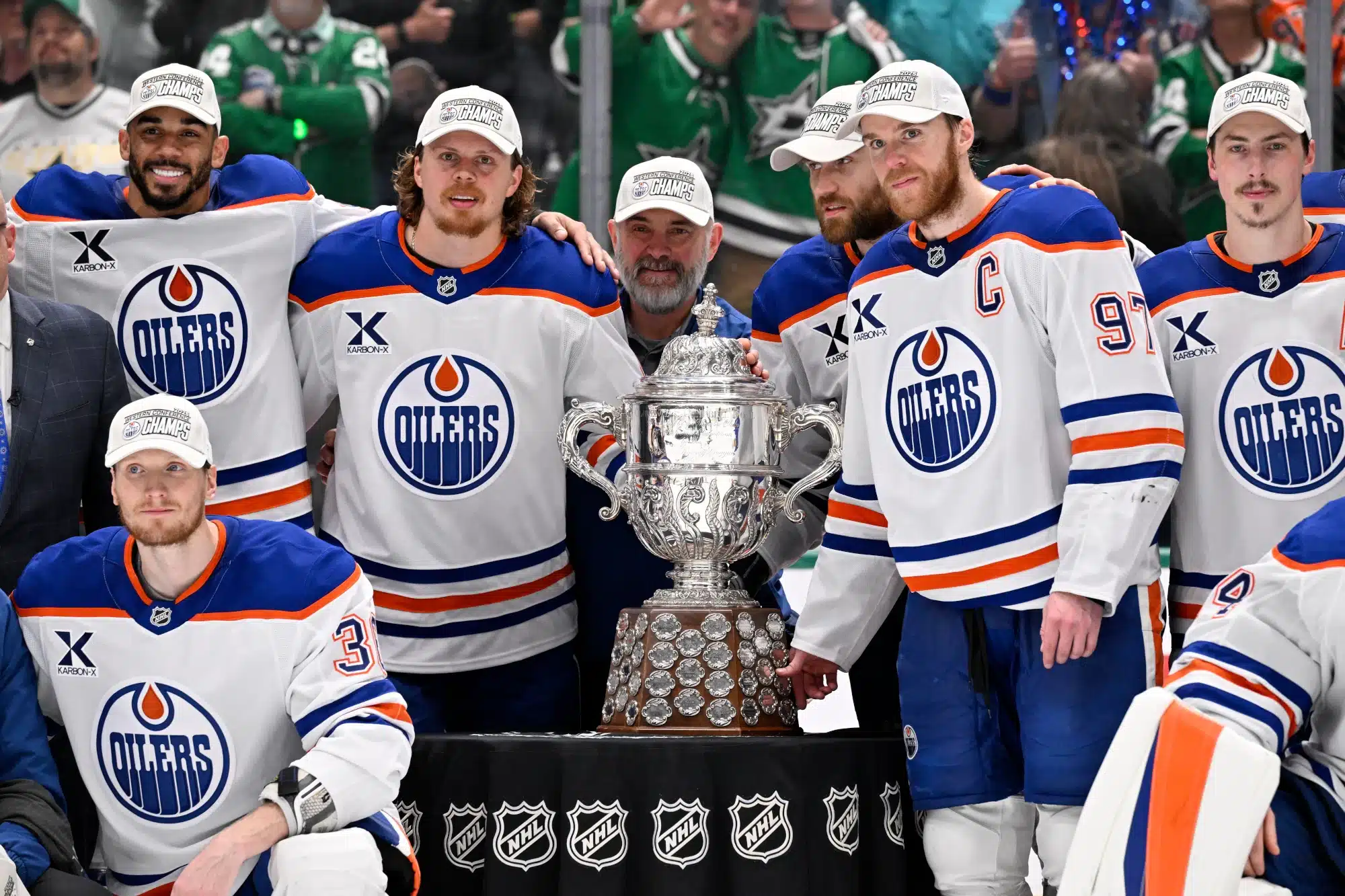 May 29, 2025; Dallas, Texas, USA; The Edmonton Oilers pose with the trophy after winning the Western Conference Final of the 2025 Stanley Cup Playoffs at American Airlines Center.