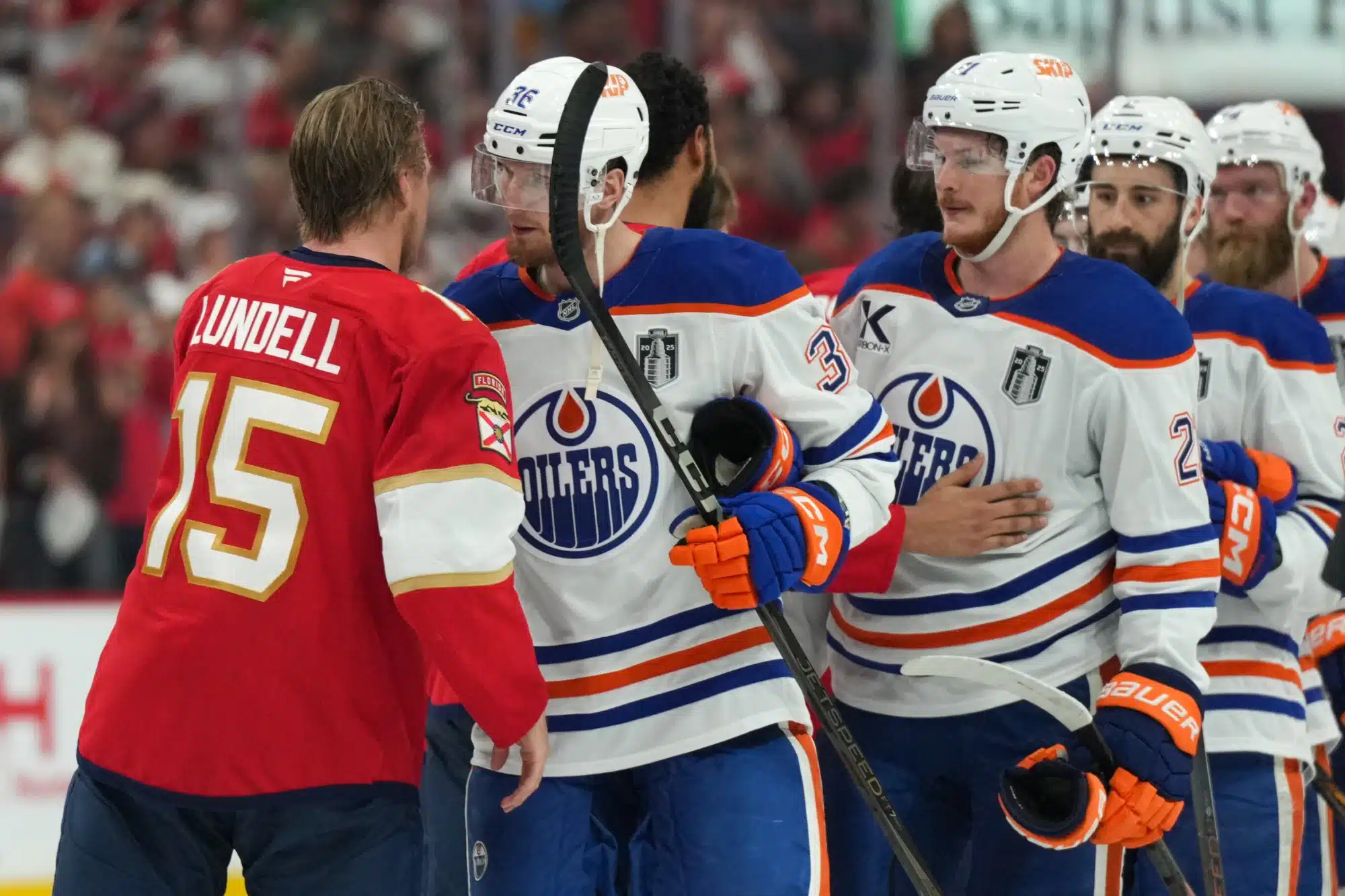 Jun 17, 2025; Sunrise, Florida, USA; Florida Panthers center Anton Lundell (15) shakes hands with the against the Edmonton Oilers after game six of the 2025 Stanley Cup Final at Amerant Bank Arena.