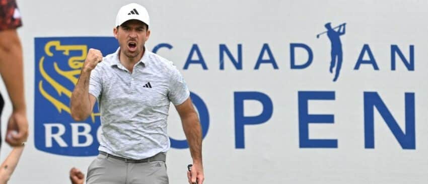 Nick Taylor reacts after sinking a birdie putt on the 18th green to take the tournament lead during the final round of the RBC Canadian Open golf tournament.