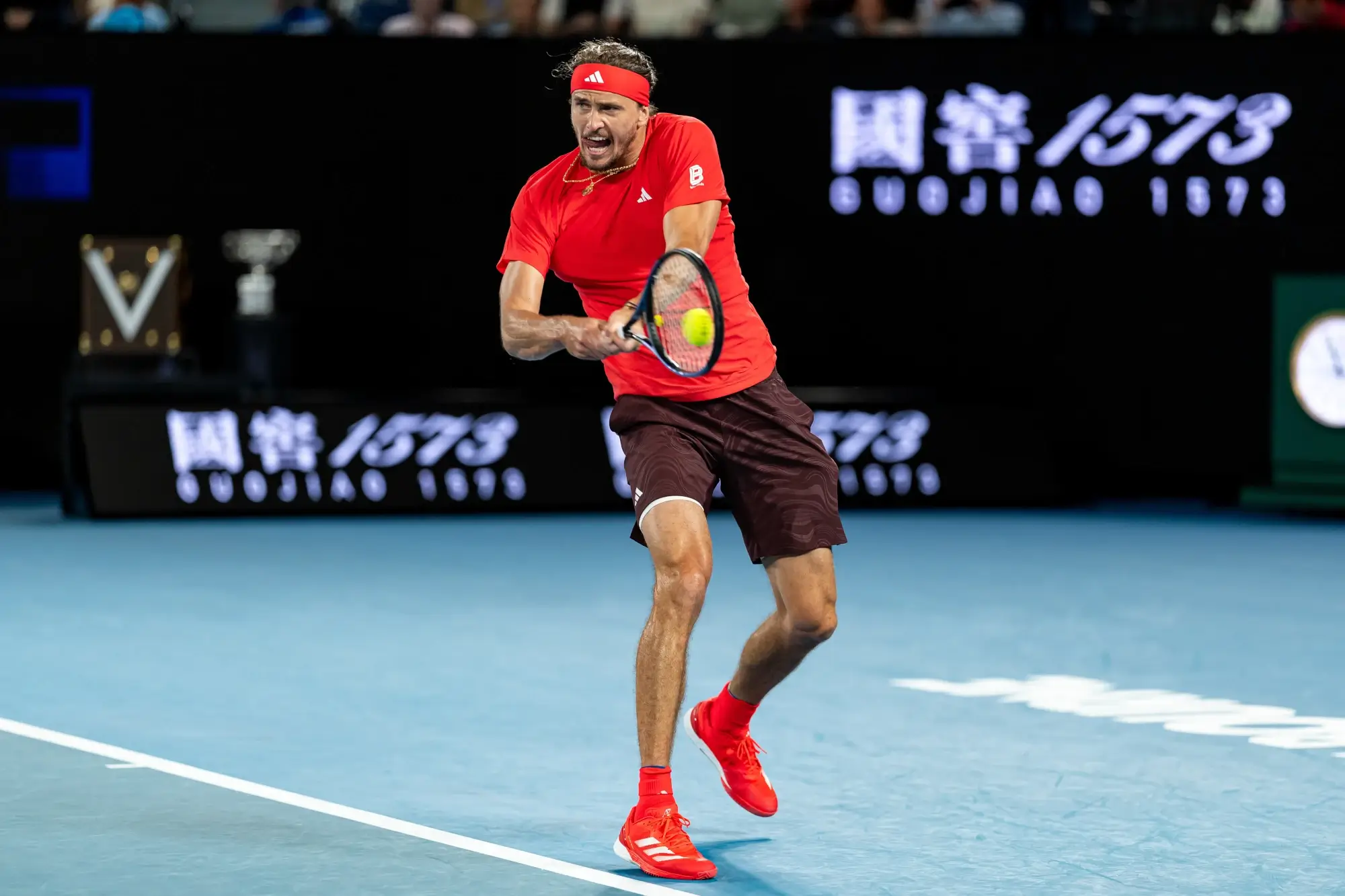 Jan 26, 2025; Melbourne, Victoria, Australia; Alexander Zverev of Germany plays a backhand during his match against Jannik Sinner of Italy in the final of the men's singles at the 2025 Australian Open at Melbourne Park.