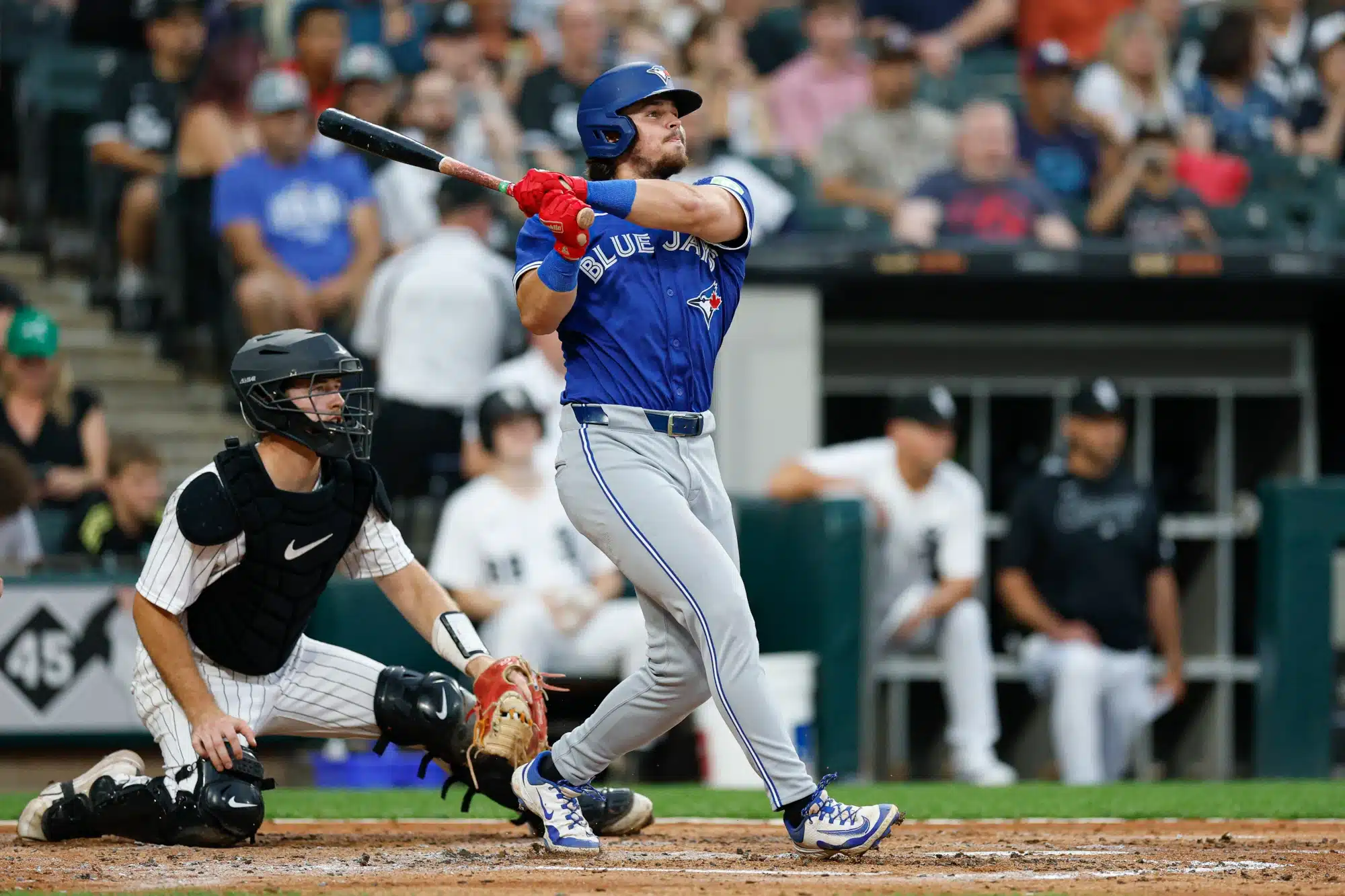 Jul 8, 2025; Chicago, Illinois, USA; Toronto Blue Jays third baseman Addison Barger (47) hits an RBI-double against the Chicago White Sox during the third inning at Rate Field.