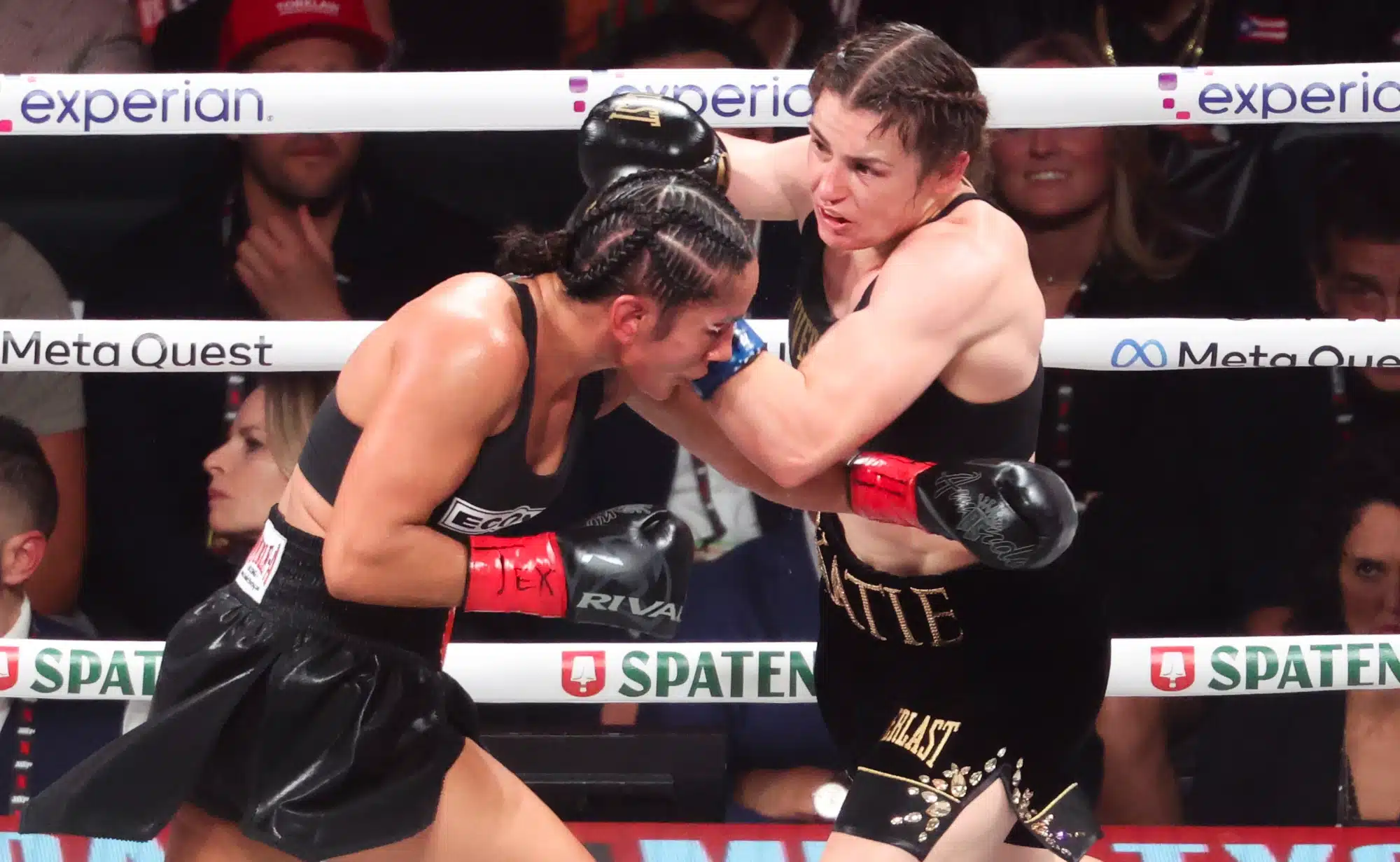 Nov 15, 2024; Arlington, Texas, UNITED STATES; Amanda Serrano (red gloves) fights Katie Taylor(blue gloves) at AT&T Stadium.