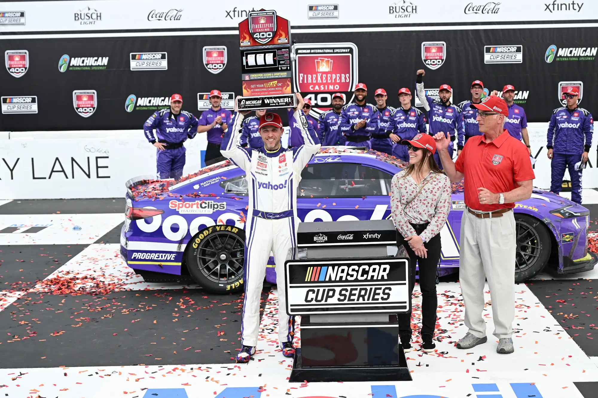 Jun 8, 2025; Brooklyn, Michigan, USA; NASCAR Cup Series driver Denny Hamlin (11) crosses the finish line to win the FireKeepers Casino 400 at Michigan International Speedway.