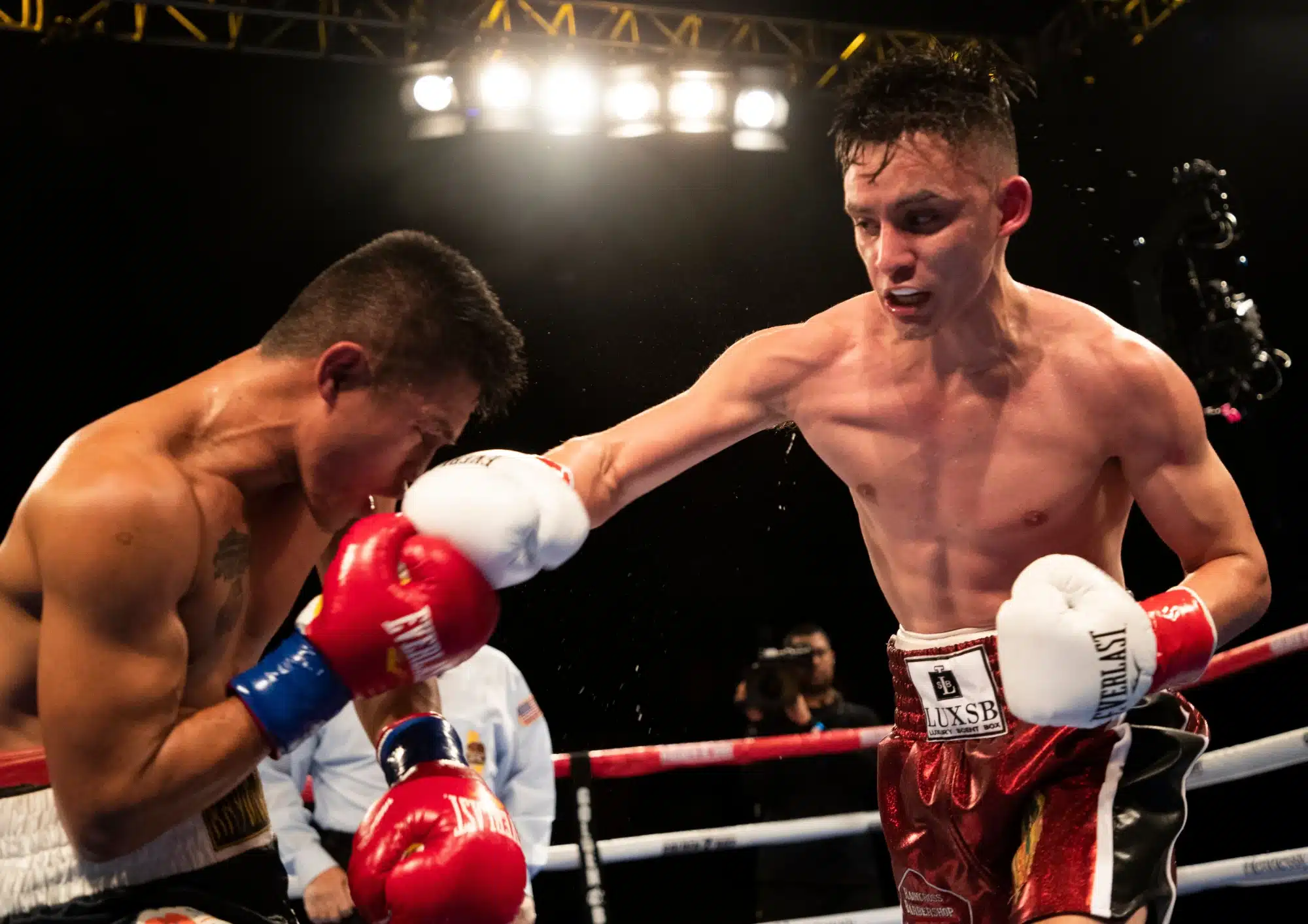 At right, Ricardo Sandoval of Riverside lands a shot on Raymond Tabugon of the Philippines during their flyweight bout at Fantasy Springs Casino.