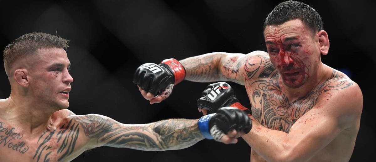Max Holloway (red gloves) fights Dustin Poirier (blue gloves) during UFC 236 at State Farm Arena. Poirier won by unanimous decision.