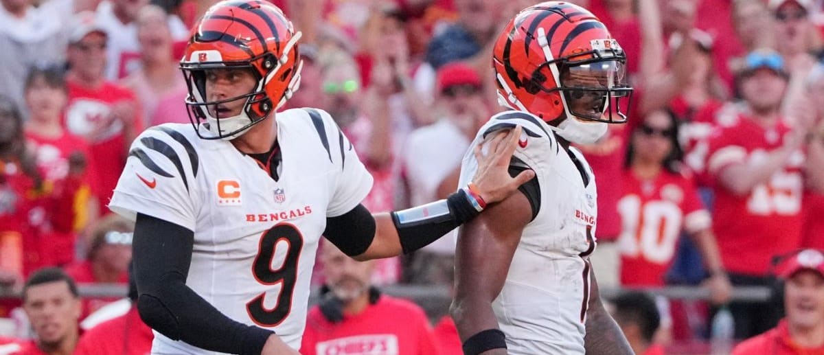 Cincinnati Bengals quarterback Joe Burrow (9) restrains wide receiver Ja'Marr Chase (1) after an altercation with officials during the second half of the game against the Kansas City Chiefs at GEHA Field at Arrowhead Stadium.