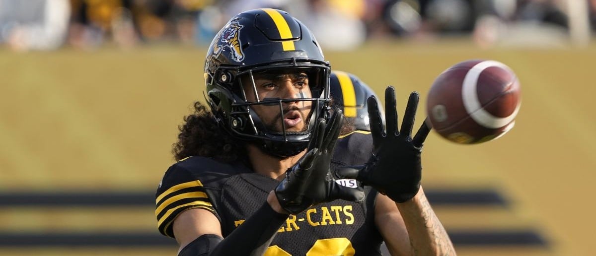 Hamilton Tiger-Cats wide receiver Kenny Lawler (89) goes to catch a pass during warm up before a game against the Saskatchewan Roughriders at Hamilton Stadium.