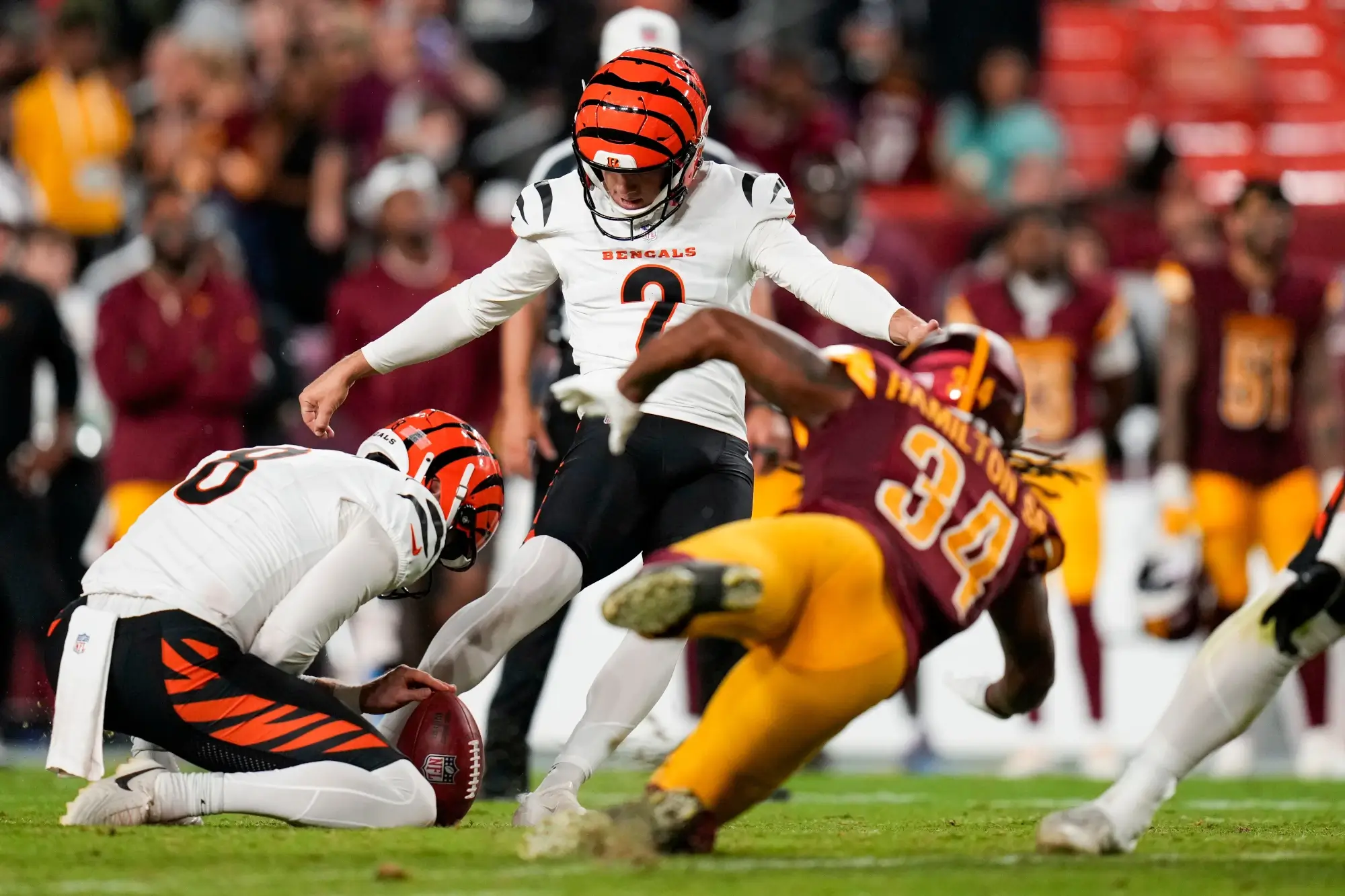 Cincinnati Bengals place kicker Evan McPherson (2) kicks a 54-yard field foal in the fourth quarter of the NFL Preseason Week 2 game between the Washington Commanders and the Cincinnati Bengals at Northwest Stadium in Landover, Md., on Monday, Aug. 18, 2025.