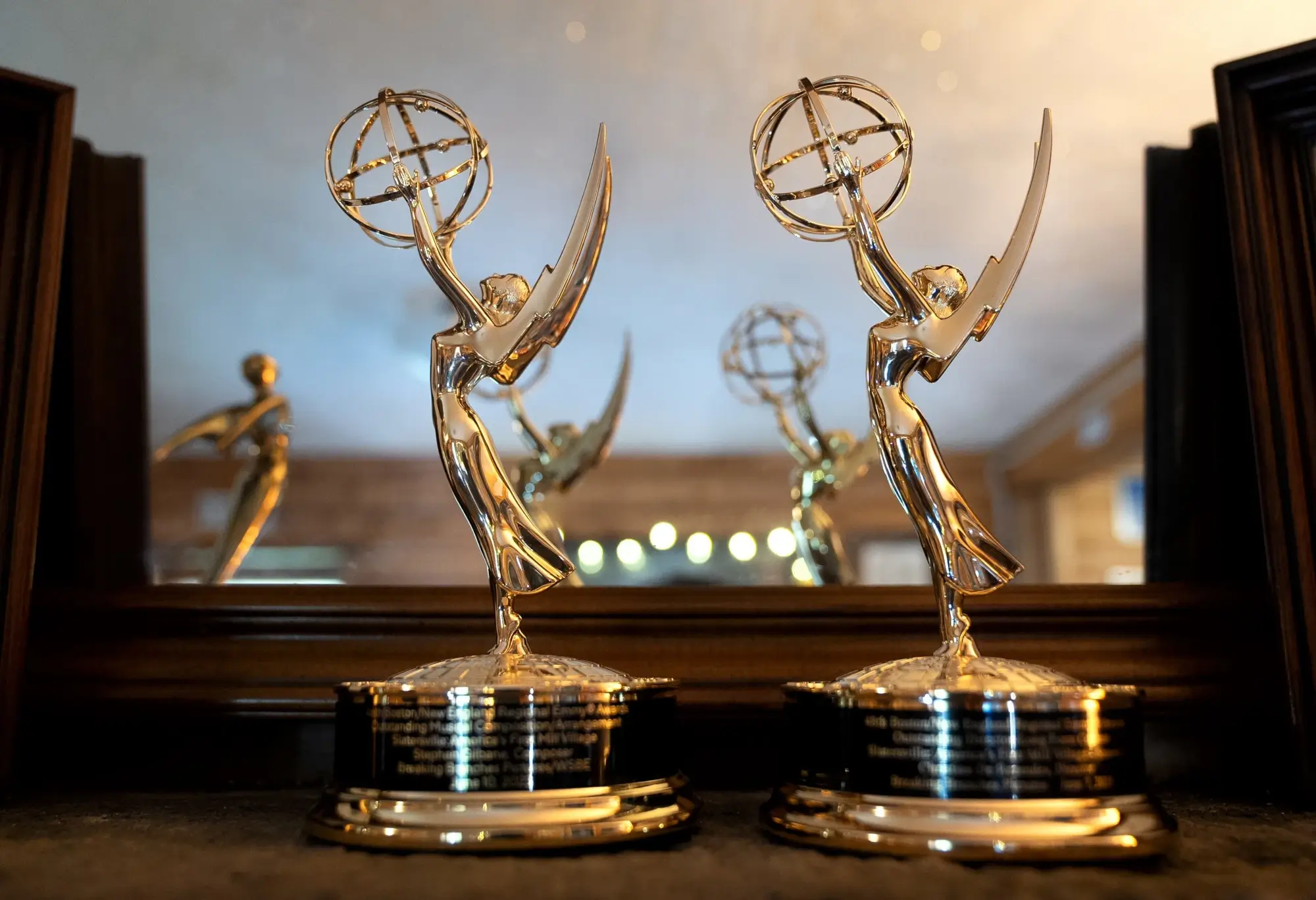 Two Emmy Awards sitting on display.