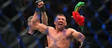 Dricus Du Plessis (blue gloves) celebrates defeating Sean Strickland (red glove) during UFC 297 at ScotiaBank Arena.