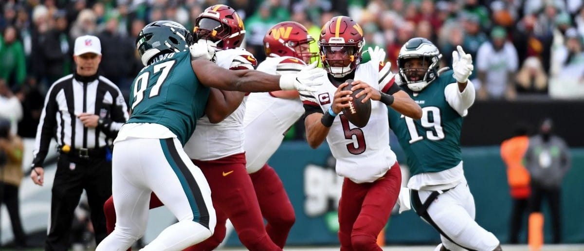 Washington Commanders quarterback Jayden Daniels (5) looks to pass the ball against the Philadelphia Eagles during the first half in the NFC Championship game at Lincoln Financial Field