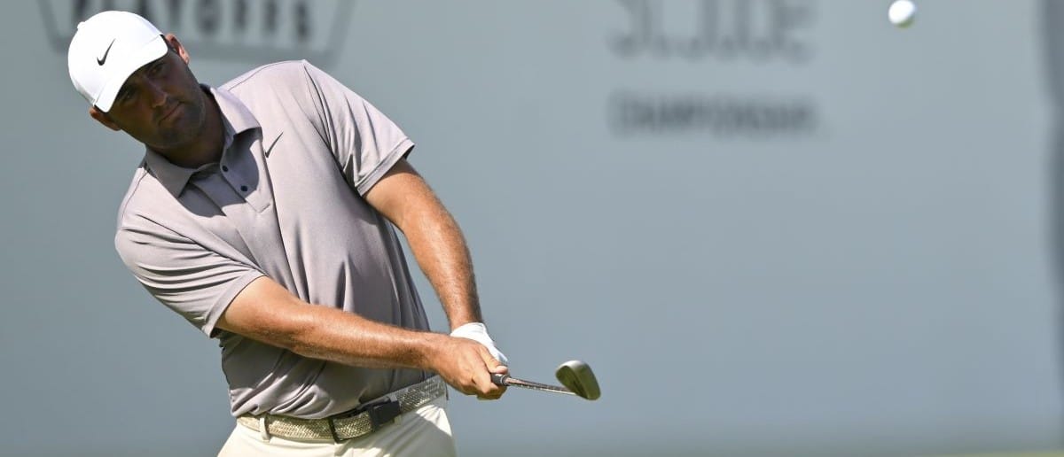Scottie Scheffler chips from the rough on 17th hole during the final round of the FedEx St. Jude Championship golf