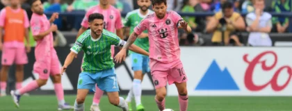 Aug 31, 2025; Seattle, Washington, USA; Inter Miami CF forward Lionel Messi (10) plays the ball while defended by Seattle Sounders FC midfielder Cristian Roldan (7) during the second half at Lumen Field.