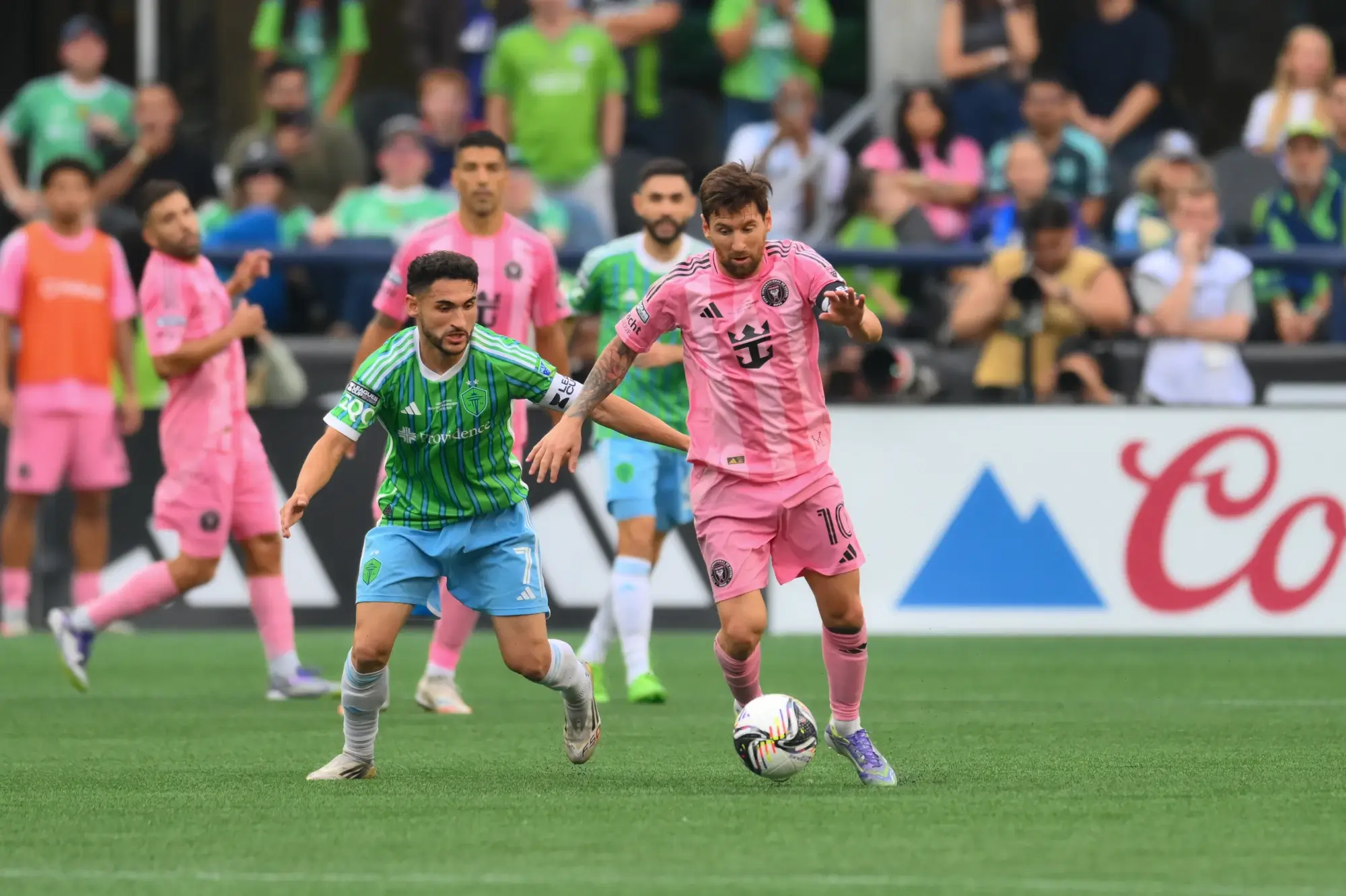 Aug 31, 2025; Seattle, Washington, USA; Inter Miami CF forward Lionel Messi (10) plays the ball while defended by Seattle Sounders FC midfielder Cristian Roldan (7) during the second half at Lumen Field.