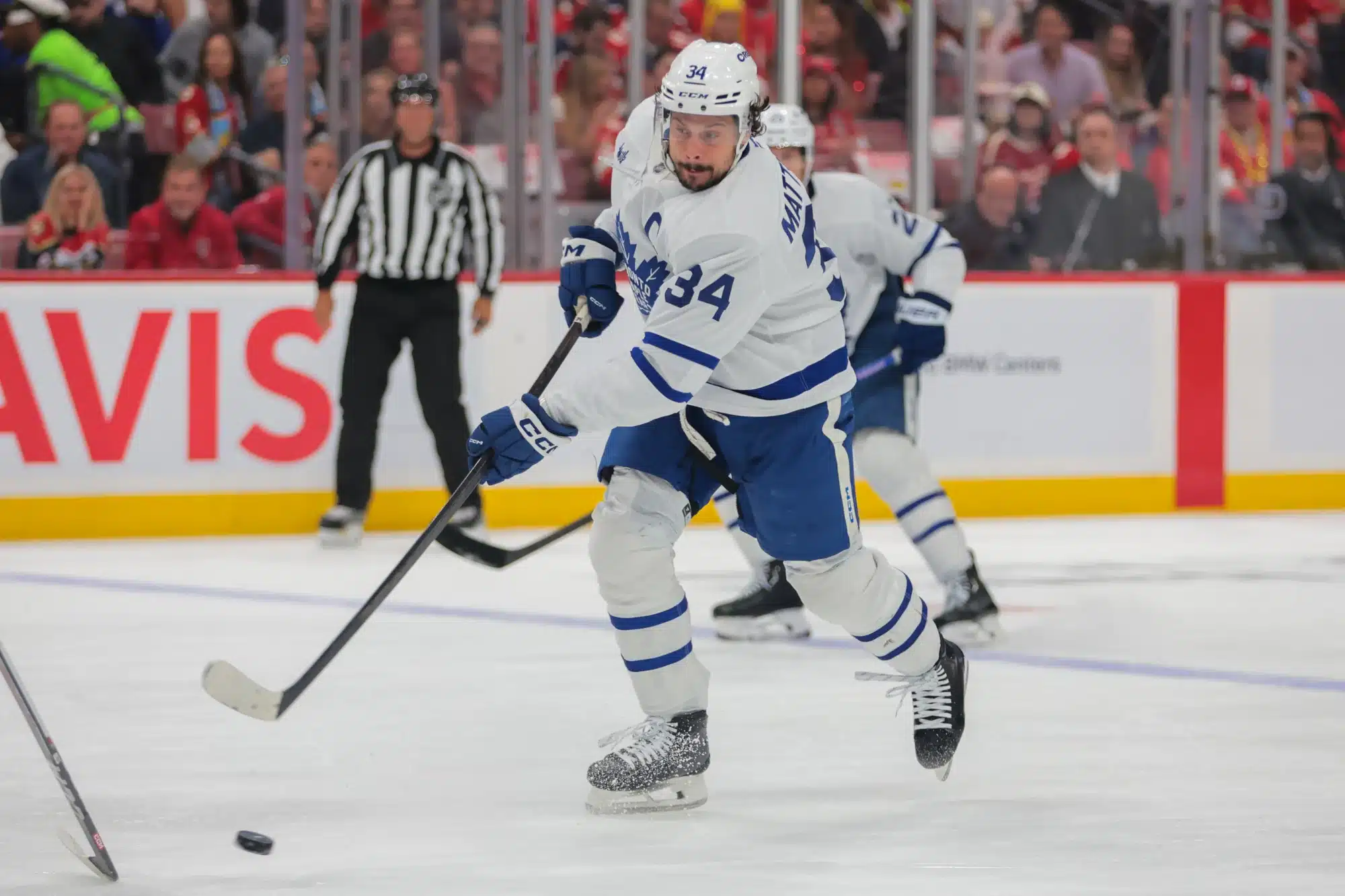 May 16, 2025; Sunrise, Florida, USA; Toronto Maple Leafs center Auston Matthews (34) shoots the puck against the Florida Panthers during the first period in game six of the second round of the 2025 Stanley Cup Playoffs at Amerant Bank Arena.