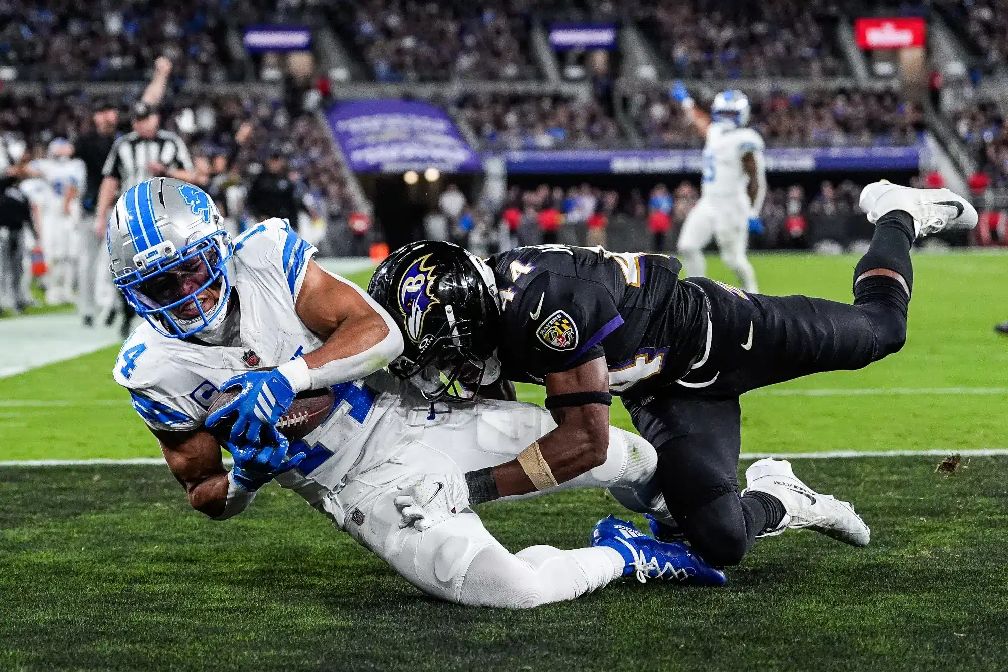 Detroit Lions wide receiver Amon-Ra St. Brown (14) makes a catch for a touchdown against Baltimore Ravens cornerback Marlon Humphrey (44) during the second half at M&T Bank Stadium in Baltimore, Md. on Monday, Sept. 22, 2025.