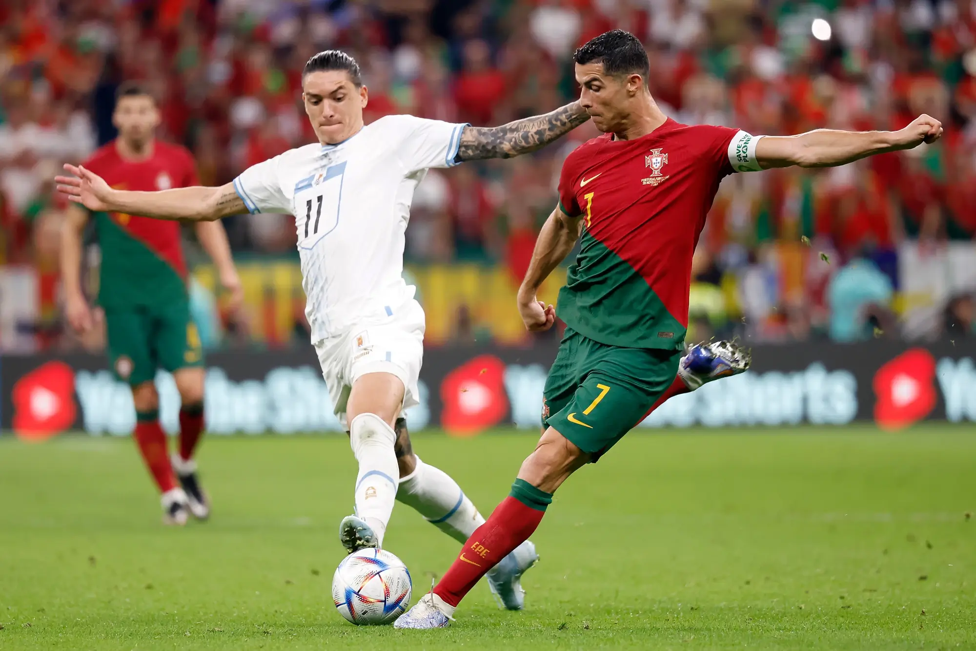 py-4 Nov 28, 2022; Lusail, Qatar; Portugal forward Cristiano Ronaldo (7) shoots on goal against Uruguay forward Darwin Nunez (11) during the second half of the group stage match in the 2022 World Cup at Lusail Stadium.