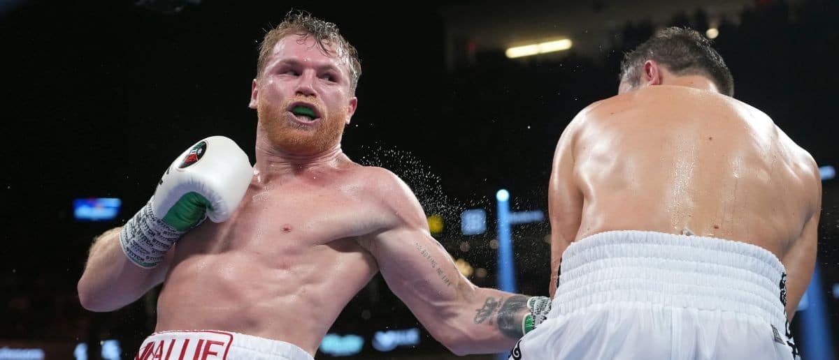 Canelo Alvarez (red trunks) and Gennadiy Golovkin (white trunks) box during their a middleweight championship bout at T-Mobile Arena.