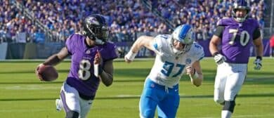 Baltimore Ravens quarterback Lamar Jackson (8) is pressured by Detroit Lions defensive lineman Aidan Hutchinson (97) during the fourth quarter at M&T Bank Stadium