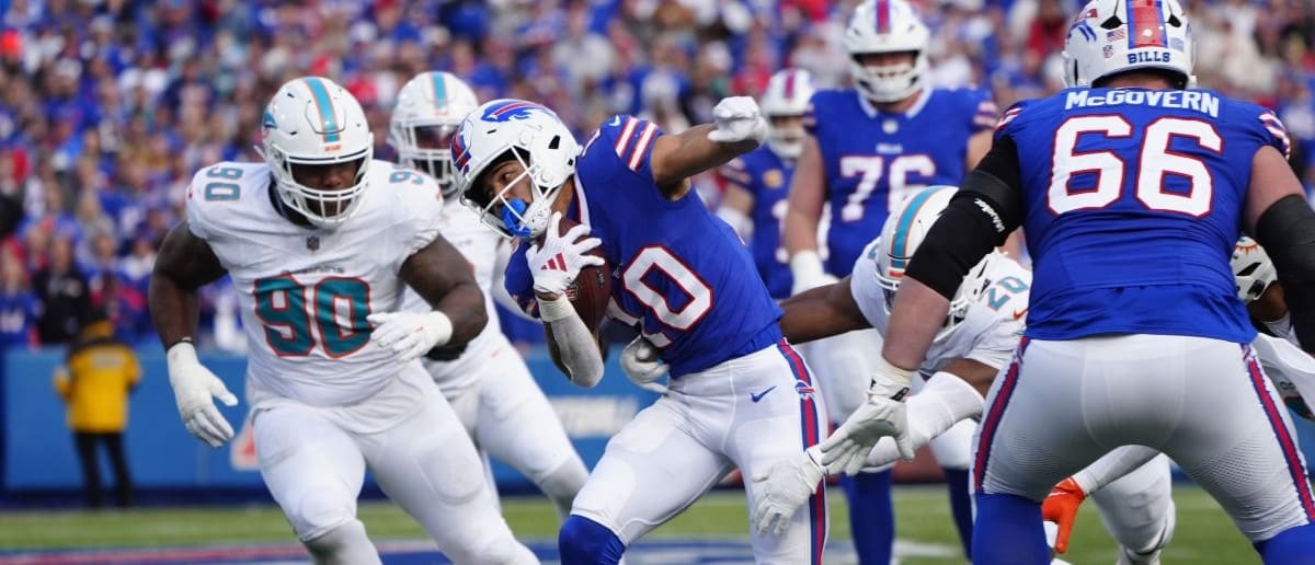 Buffalo Bills wide receiver Khalil Shakir (10) breaks a tackle running with the ball against the Miami Dolphins during the second half at Highmark Stadium.