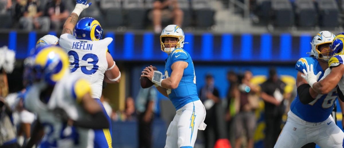 Los Angeles Chargers quarterback Justin Herbert (10) throws the ball against the Los Angeles Rams in the first half at SoFi Stadium. Mandatory Credit: Kirby Lee-Imagn Images