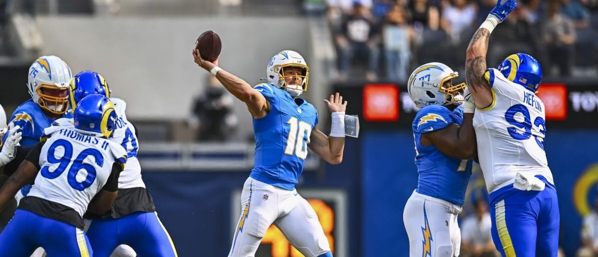 Los Angeles Chargers quarterback Justin Herbert (10) throws a pass against the Los Angeles Rams during the first quarter at SoFi Stadium