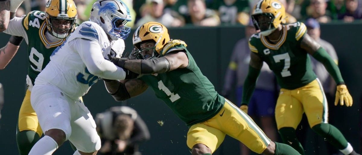 Detroit Lions offensive tackle Penei Sewell (58) blocks Green Bay Packers defensive end Micah Parsons (1) during the second quarter of their game Sunday, September 7, 2025 at Lambeau Field in Green Bay, Wisconsin.